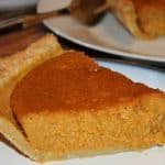 a slice of pumpkin pie on a plate