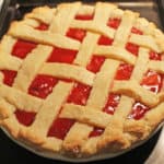 baked strawberry pie on a cookie sheet