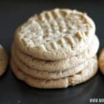 a row of peanut butter cookies with 4 stacked on top of each other