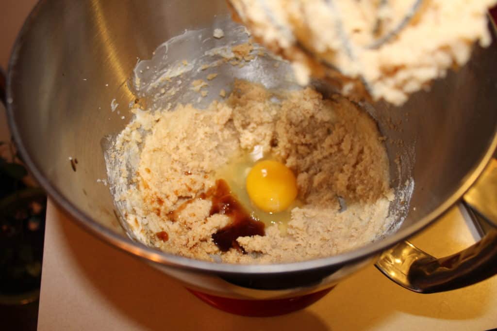 mixing bowl with butter and sugar creamed together. Then an egg and vanilla extract added to the bowl.