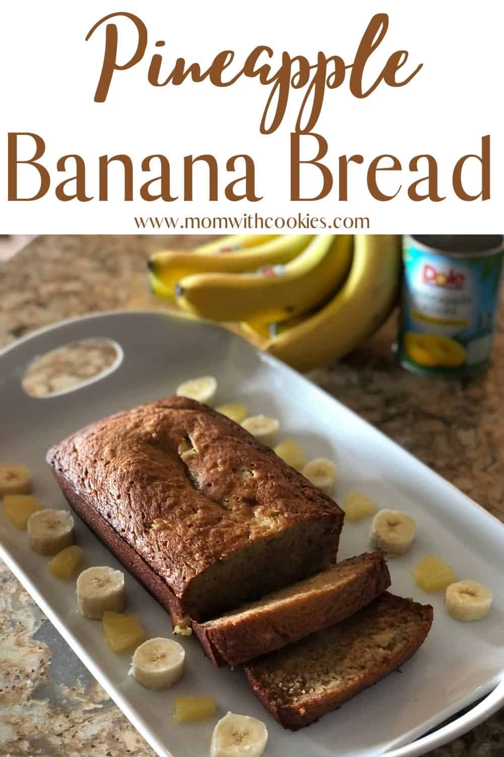 pineapple banana bread on a serving tray with little slices of banana