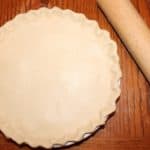 A pie that has been crimped and ready to bake.