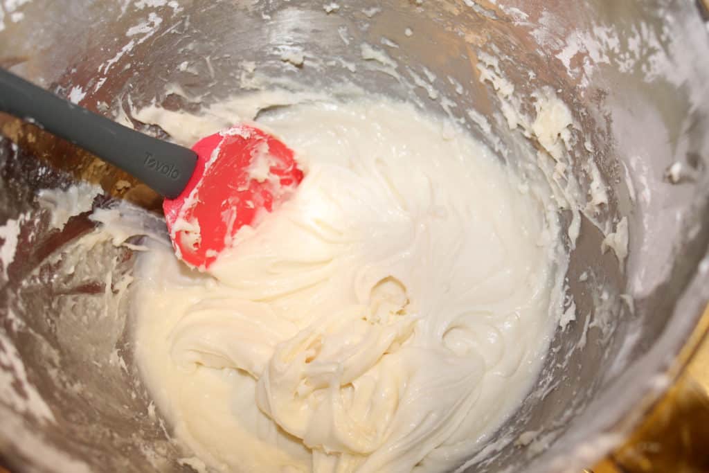 Powdered sugar, cream cheese, and vanilla mixed together thoroughly using a rubber spatula to scrape the sides of the bowl