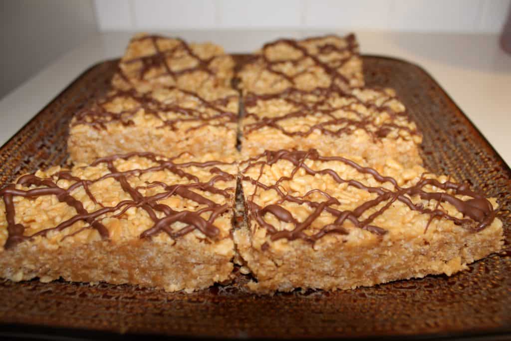 A brown plate filled with 6 large peanut butter rice crispy treats