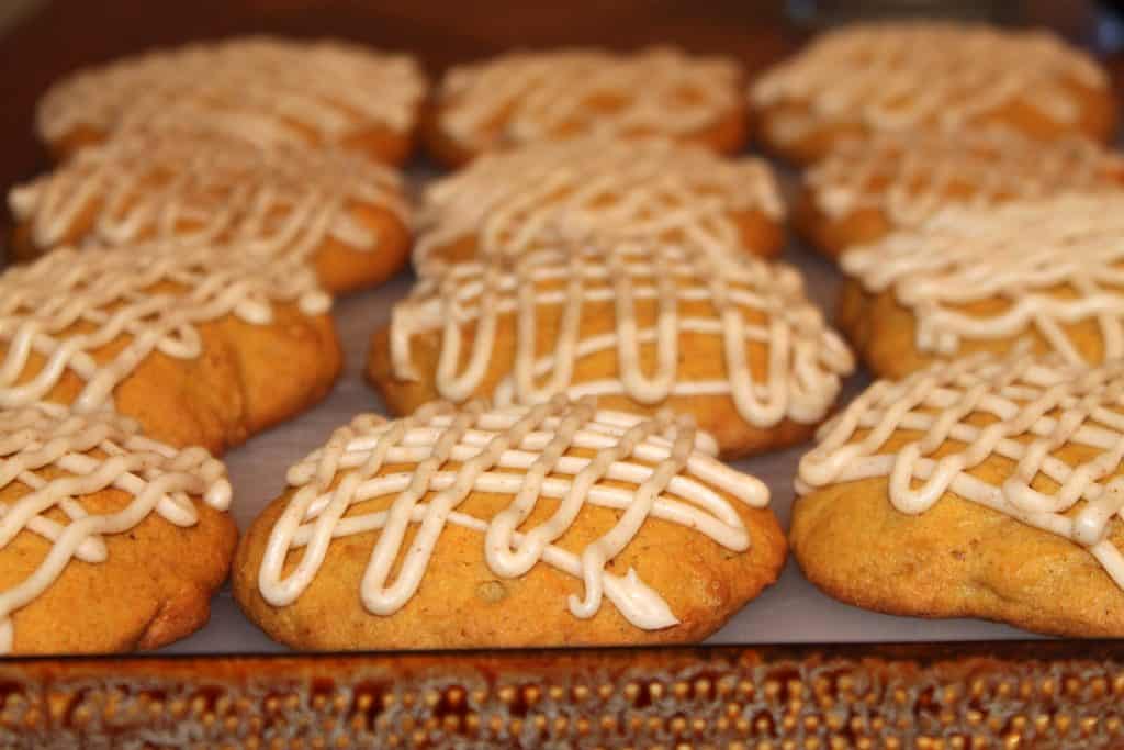 pumpkin cookies decorated with brown butter icing