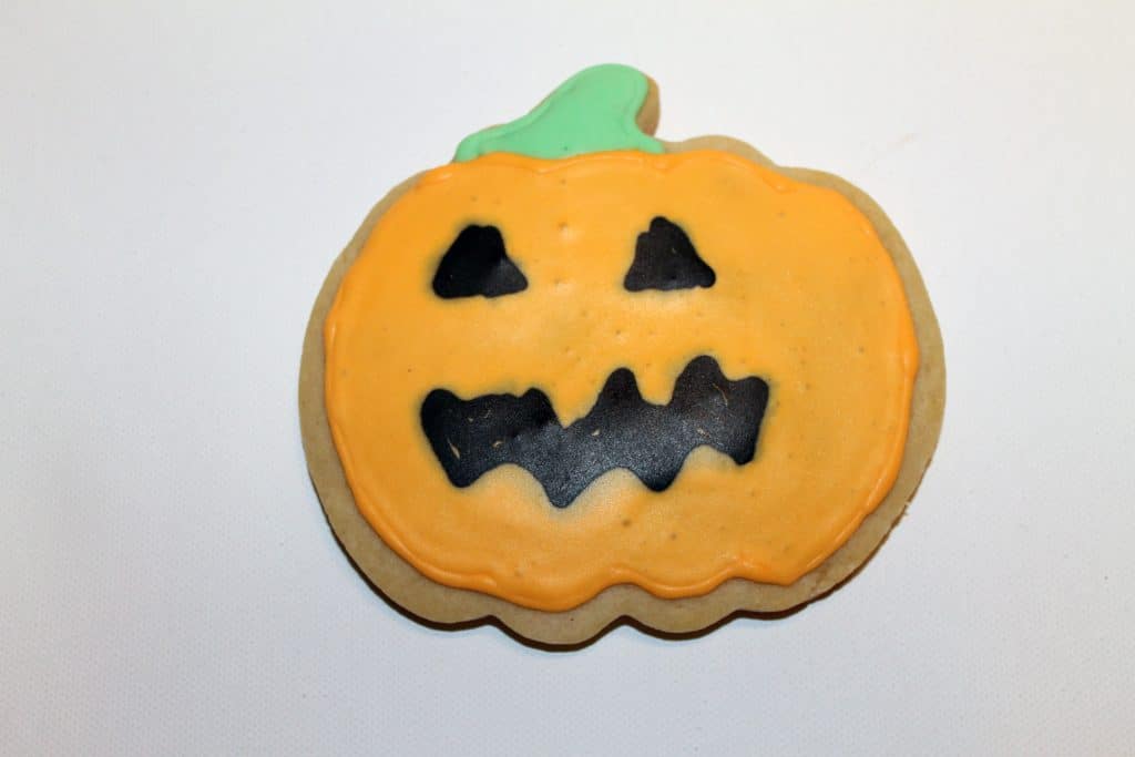 Finished and dried Jack o lantern cookie.