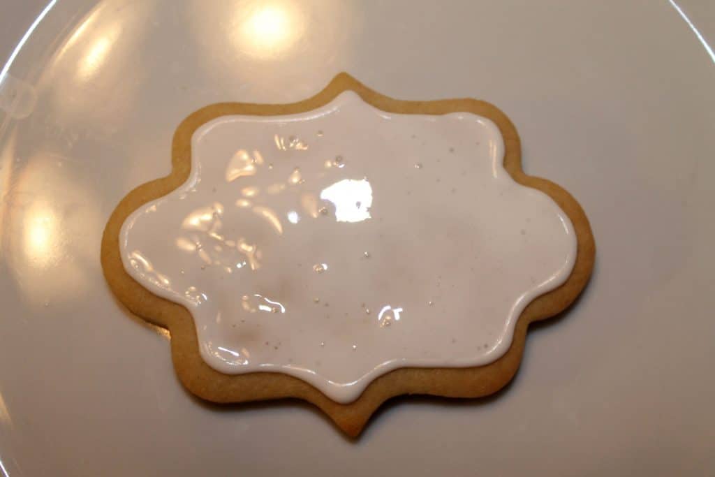 Fill the cookie in with flooding consistency royal icing.