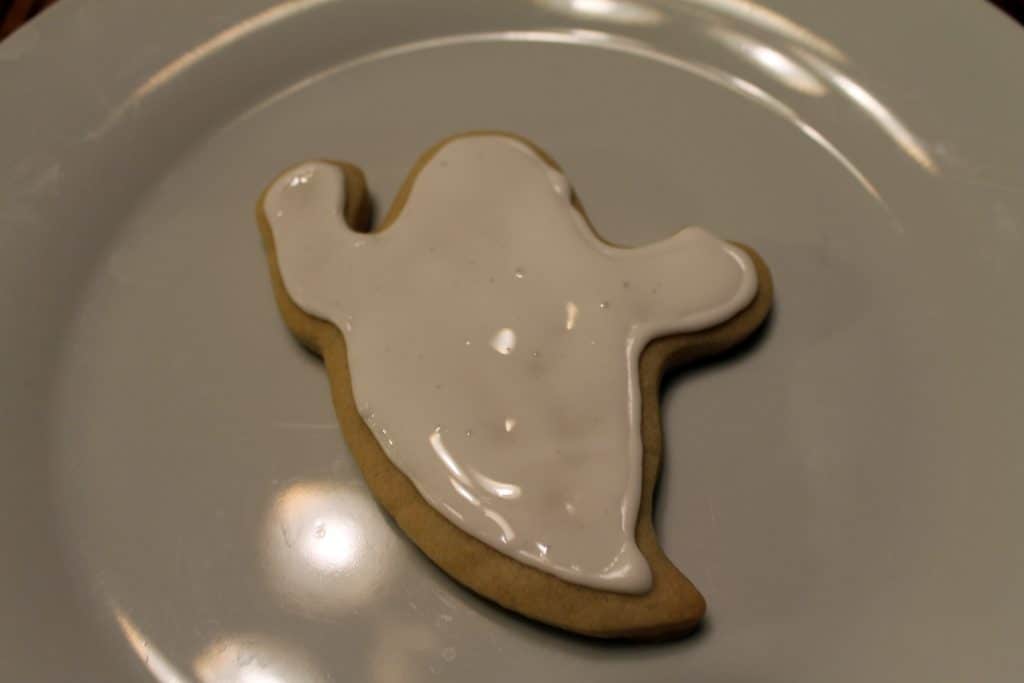 Ghost sugar cookie filled in with white royal icing.