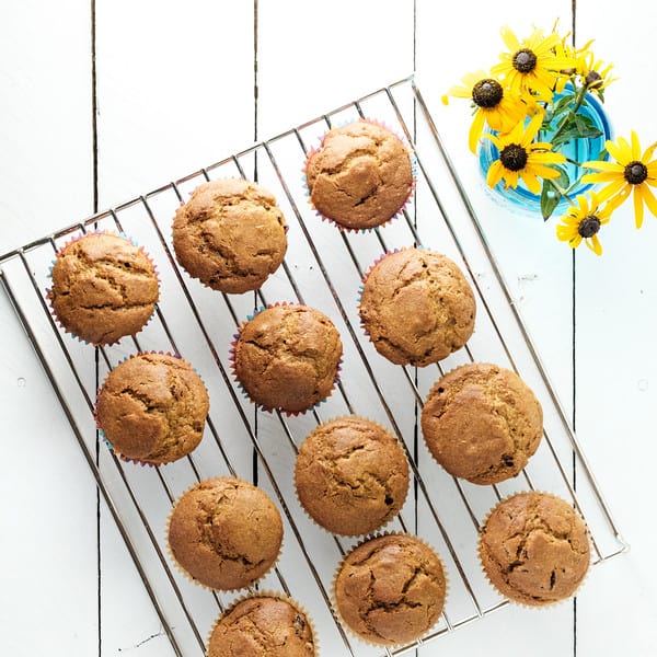 cranberry pumpkin muffins on a cooling rack