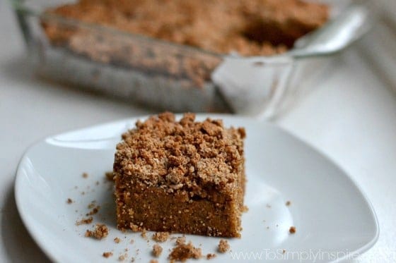 a slice of crumbly pumpkin coffee cake on a plate