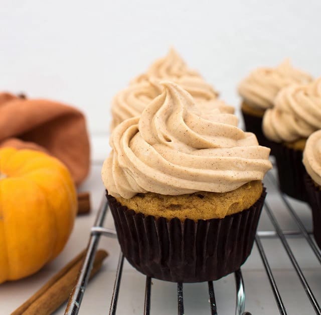 pumpkin spice cupcakes on a cooling rack