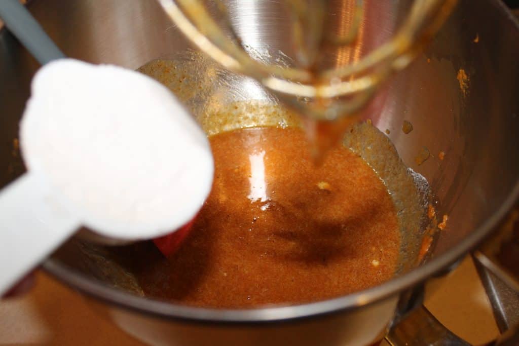 adding the flour to the mixing bowl