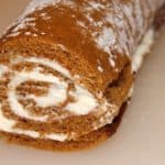 pumpkin roll rolled back up with cream cheese icing in it