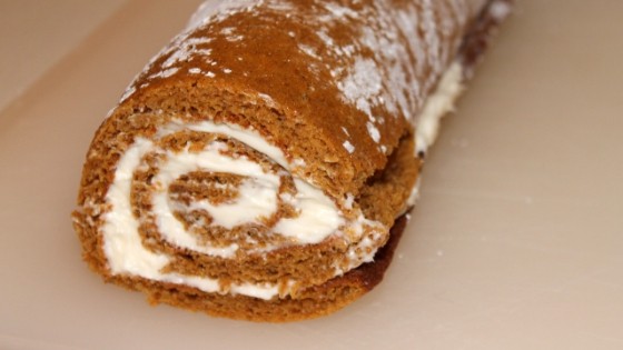 pumpkin roll rolled back up with cream cheese icing in it