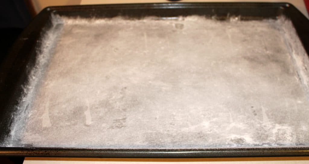 a cookie sheet that has been greased and floured and lined with wax paper