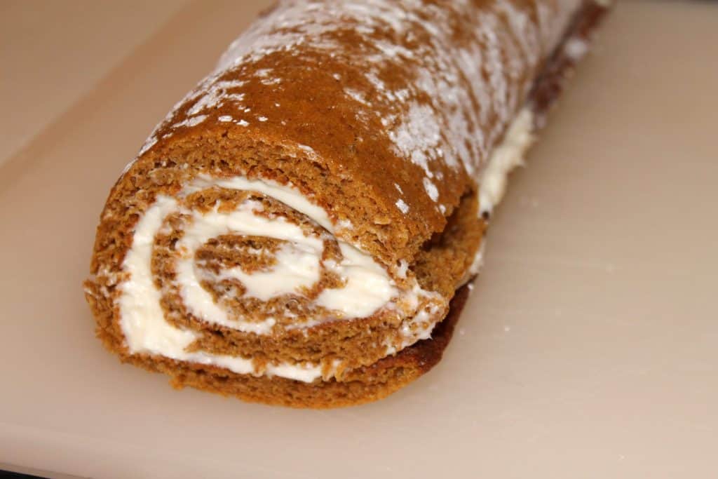 Pumpkin roll rolled back up with the cream cheese icing in it