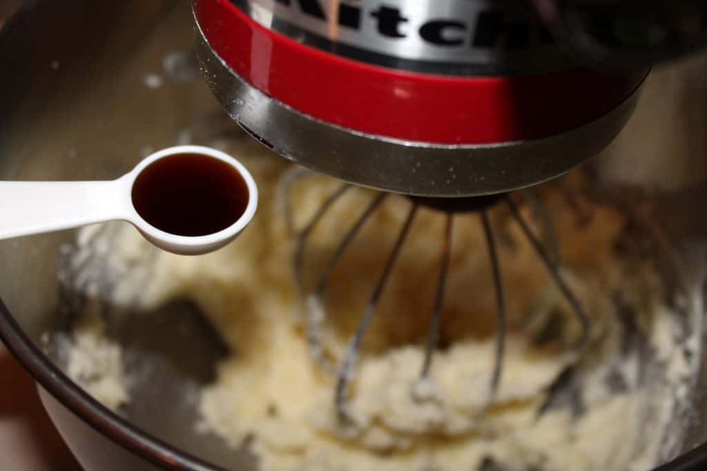 Adding vanilla extract to butter mixture.