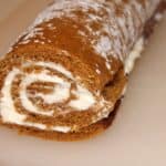 a pumpkin roll with cream cheese filling