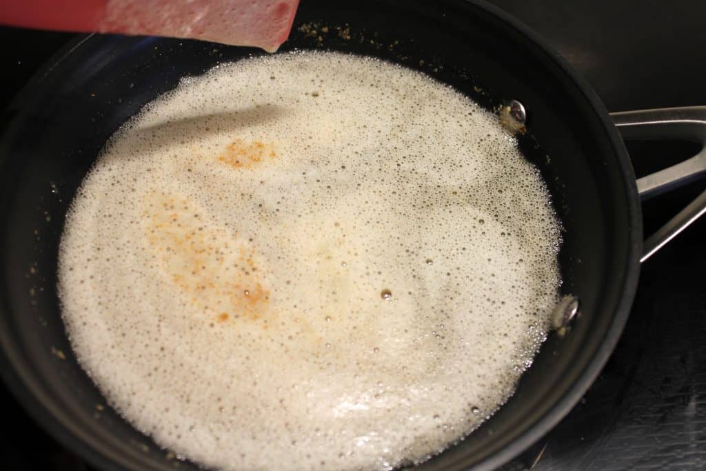 Brown butter in a frying pan for the apple pie