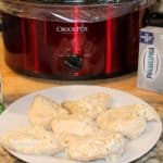 finished crockpot Italian chicken on a plate by the slow cooker