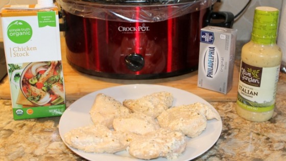 finished crockpot Italian chicken on a plate by the slow cooker