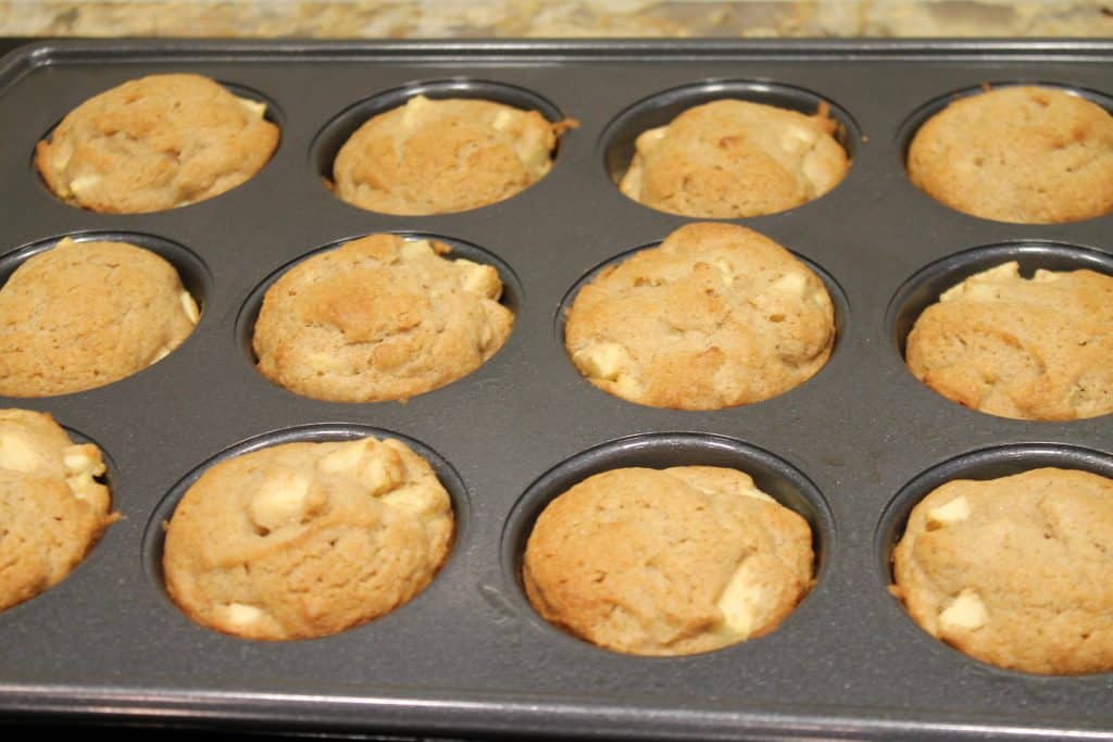 cooked apple cinnamon muffins in pan 