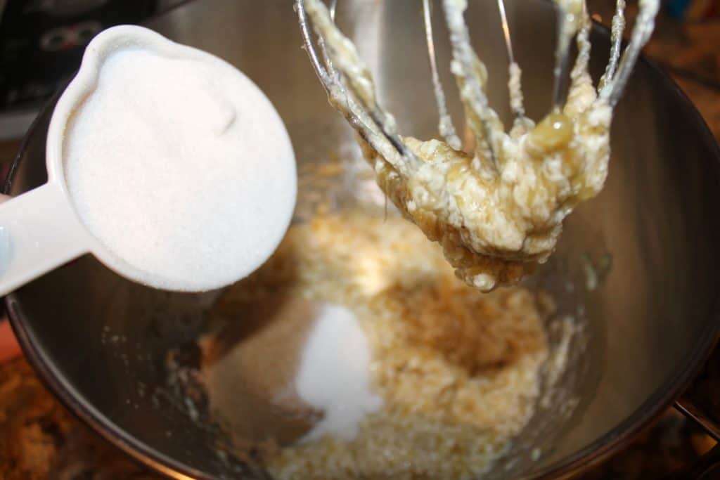 adding sugars to the mixing bowl