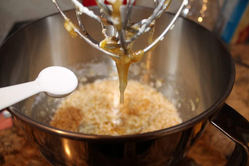 adding baking soda to the mixing bowl