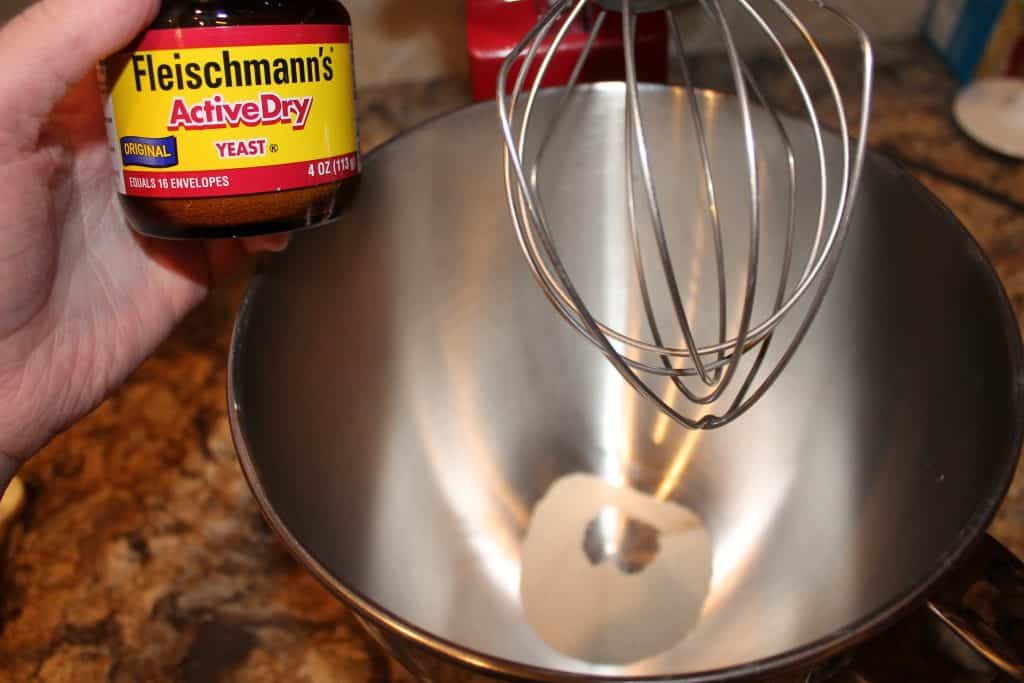 Adding yeast to large bowl.