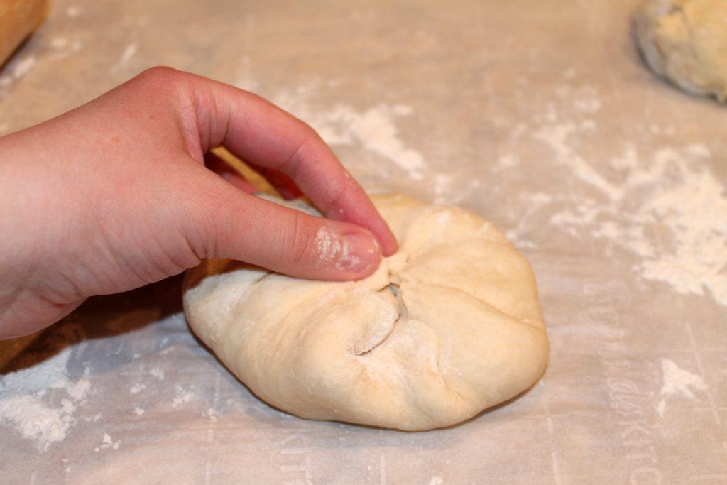 The bierocks being assembled. Pinching the dough as you bring it to the center.