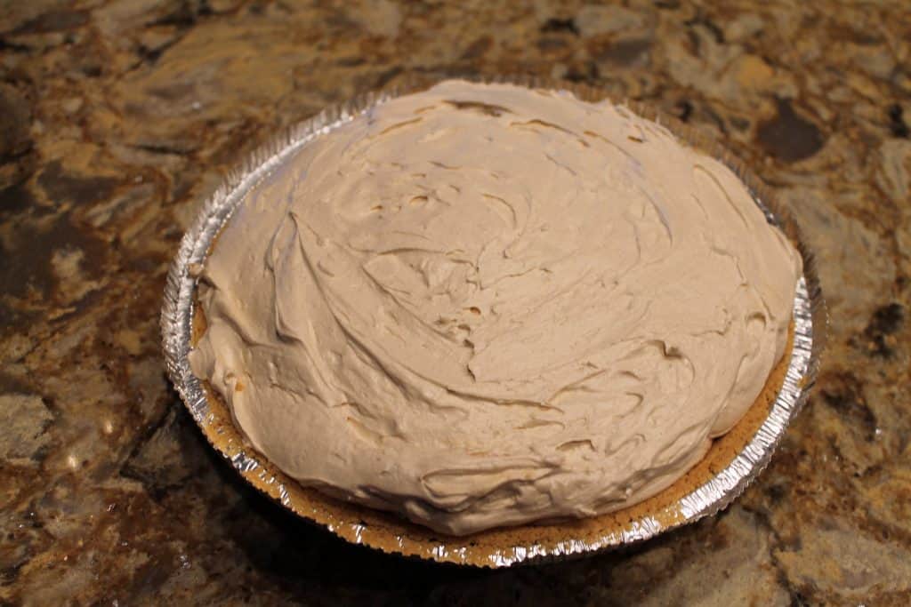 a graham cracker crust filled with the peanut butter pie filling