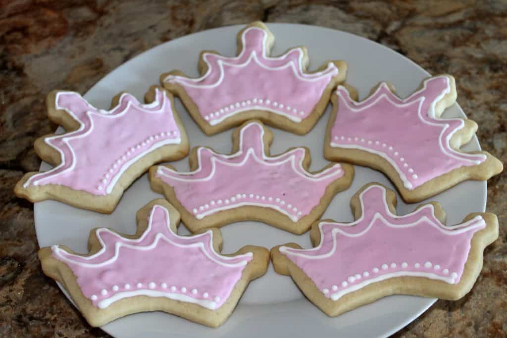 a plate of tiara shaped sugar cookies