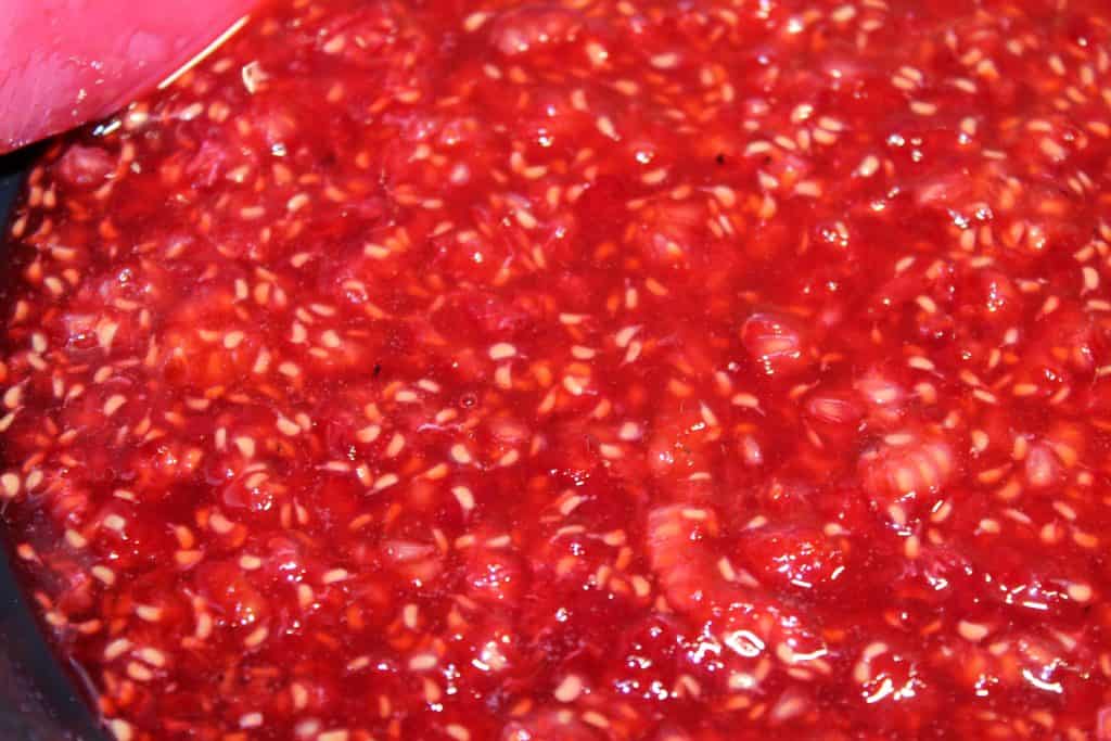 Raspberries cooked down into a puree.