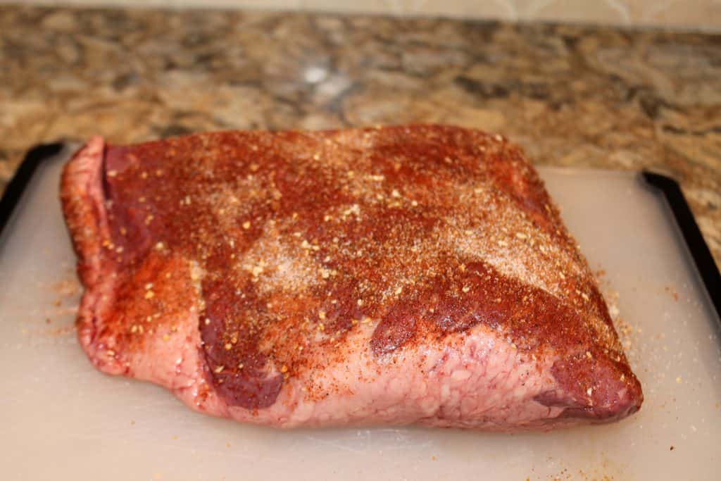 Brisket with seasonings rubbed on.