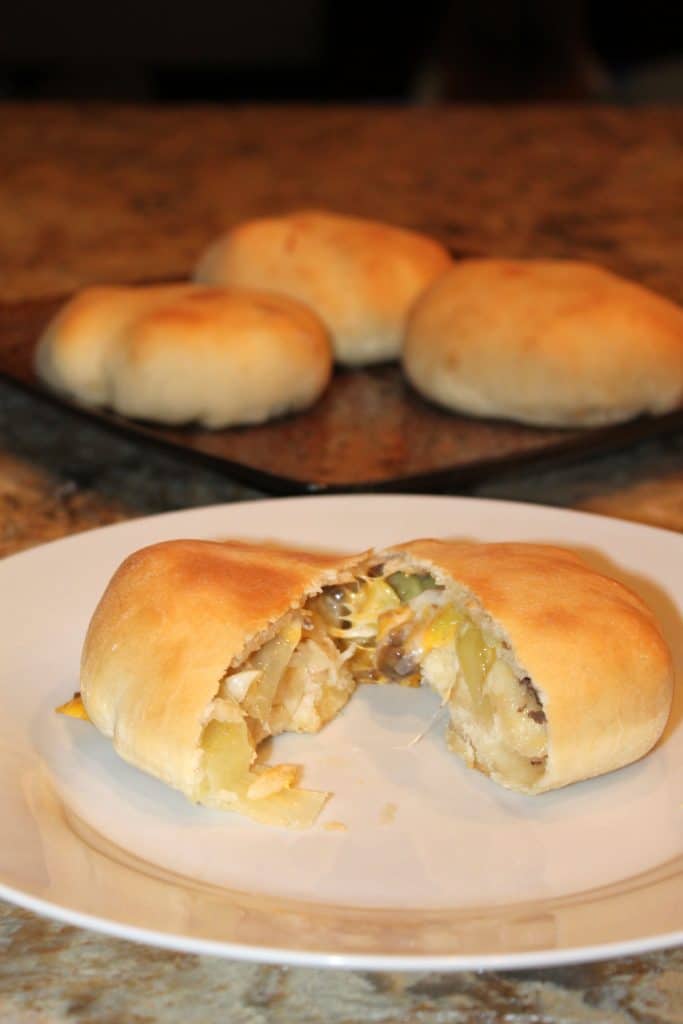 German bierocks sliced open to show the beef and cabbage filling