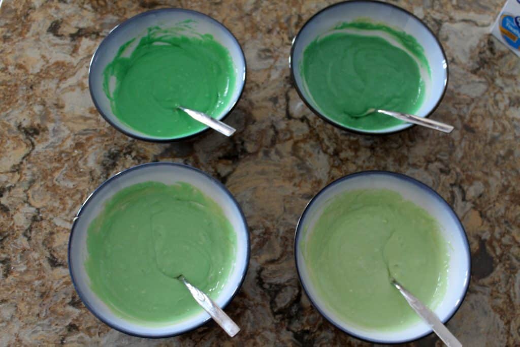 4 different shades of green cake batter.