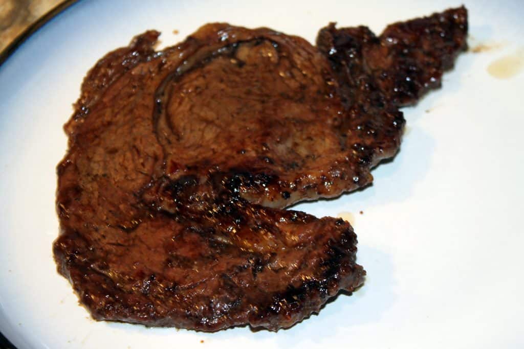 A well done steak that was pan seared.