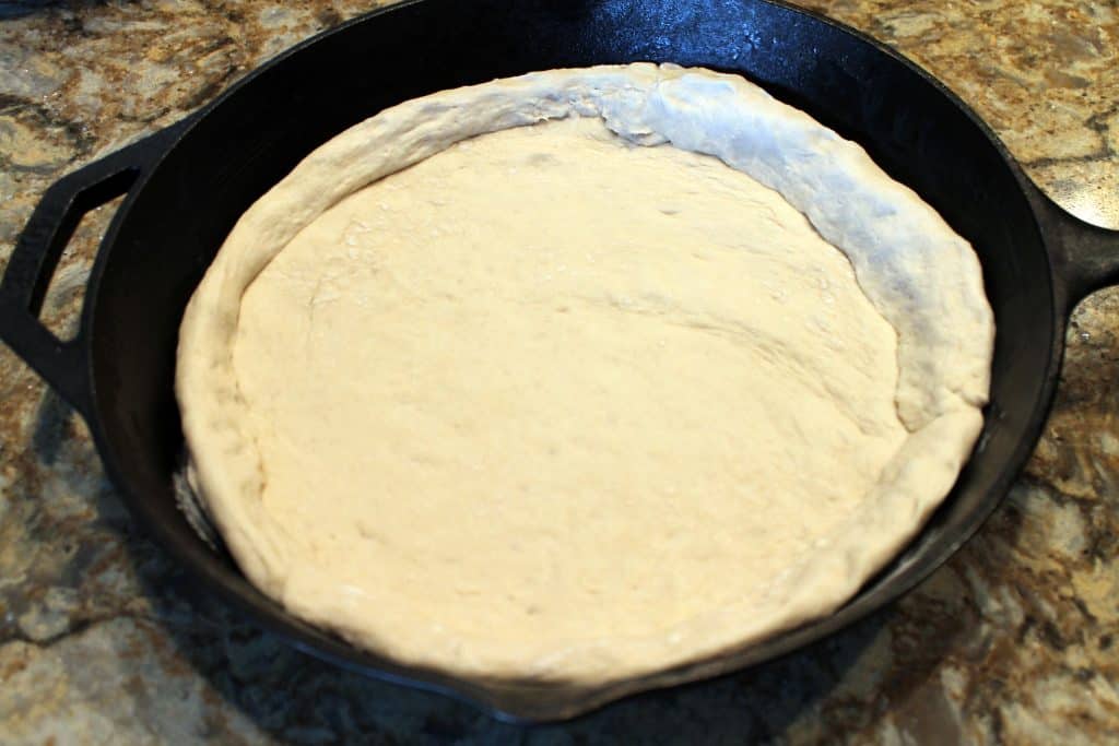 Pizza dough with sides on it