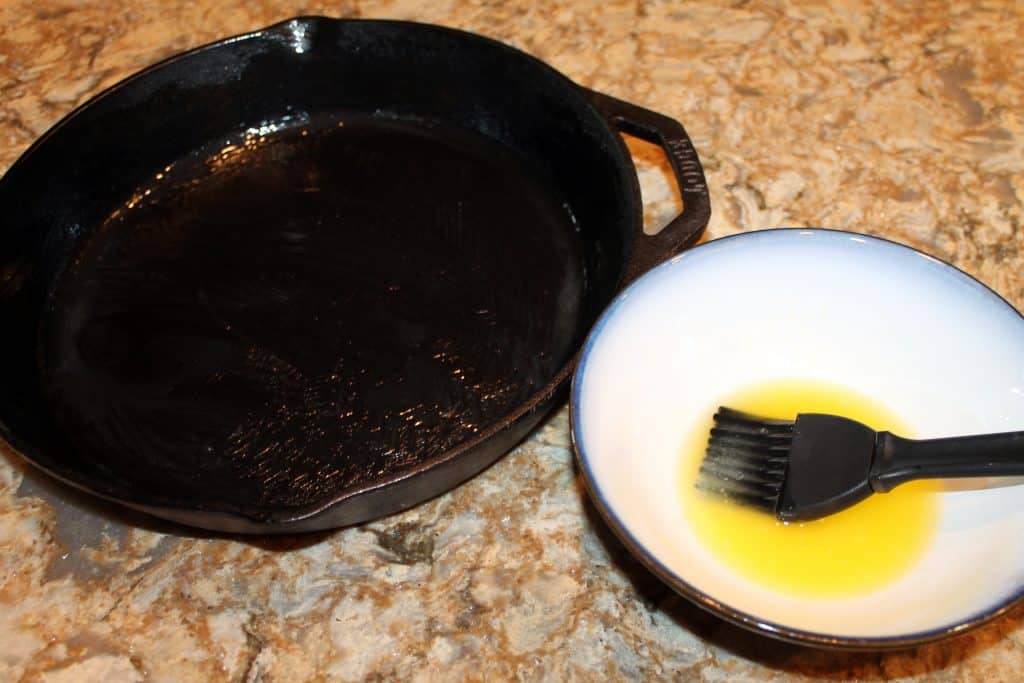 A cast iron skillet brushed with melted butter.