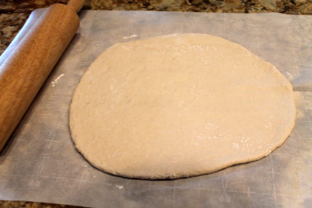 Pizza dough rolled out