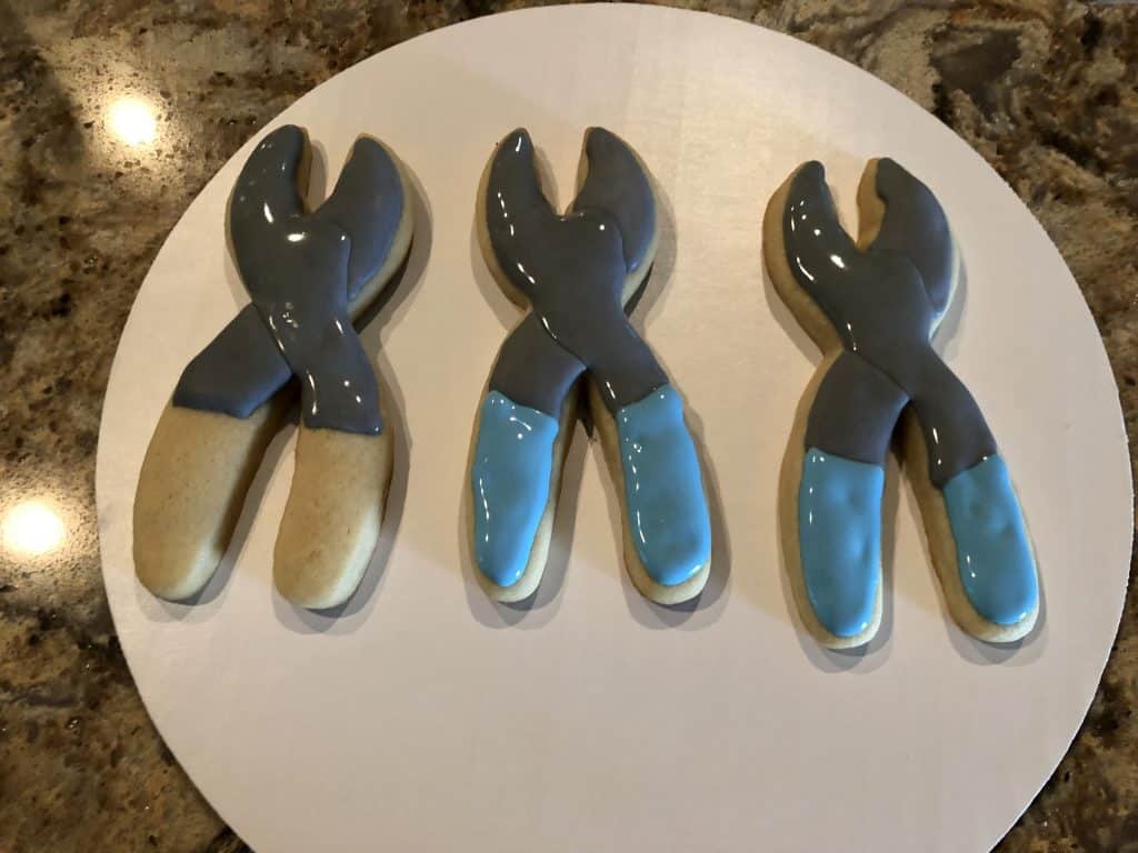 Adding more detail to the pliers cookies.