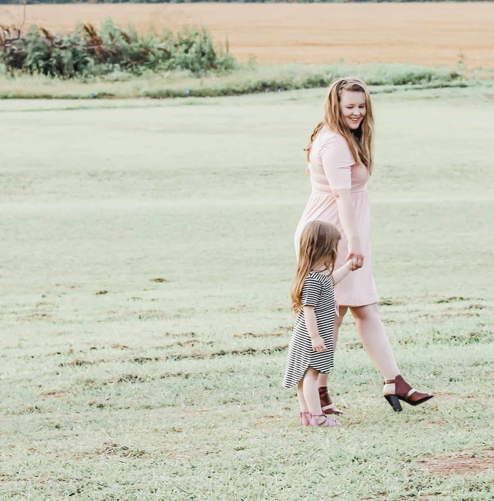 Mother and daughter both wearing dresses from PinkBlush