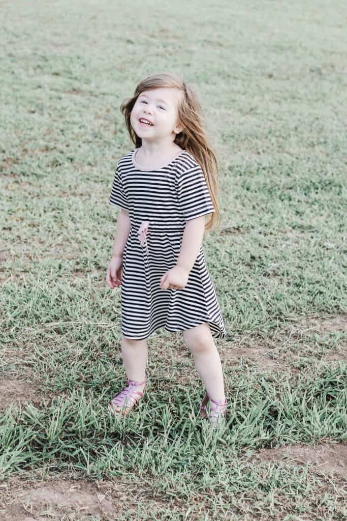 Little girl wearing black and white toddler dress