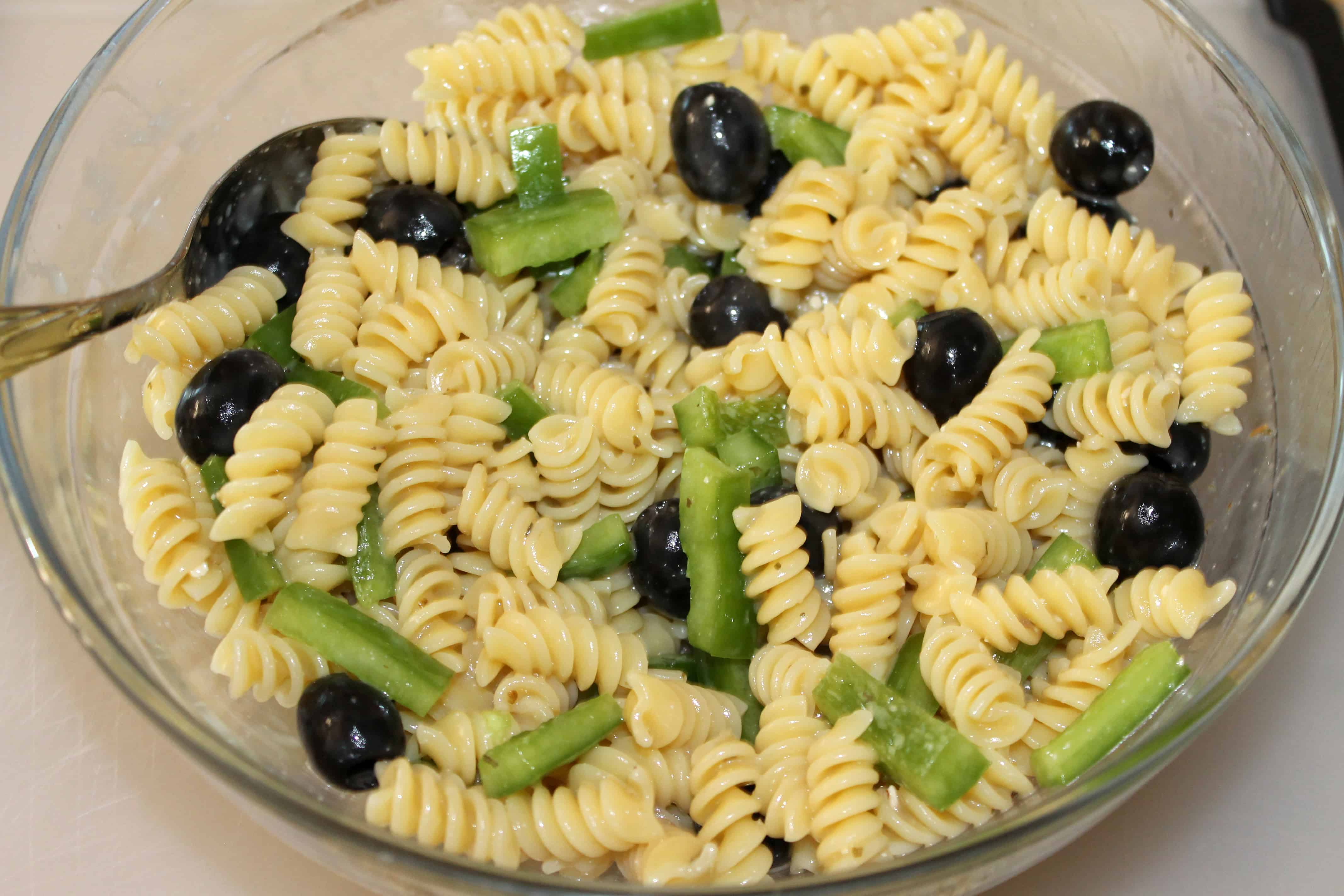 finished pasta salad with green peppers and black olives