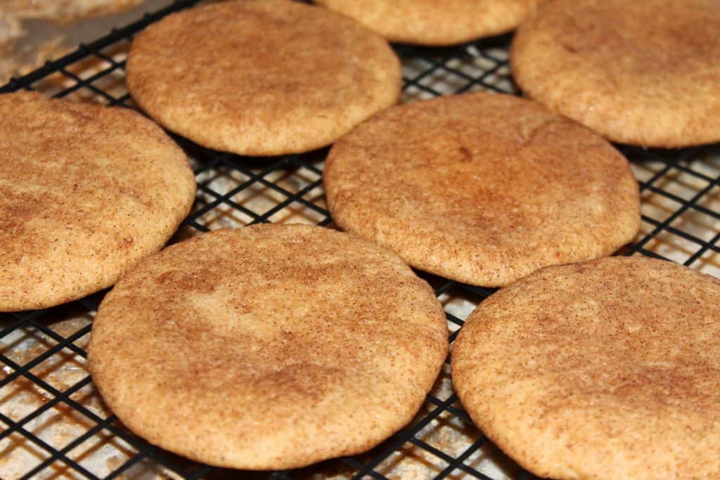 snickerdoodle cookies cooling on a rack