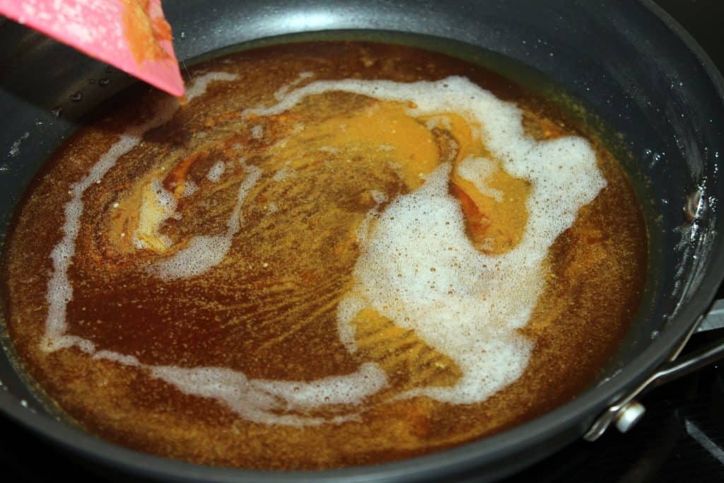 adding browned butter to the caramel