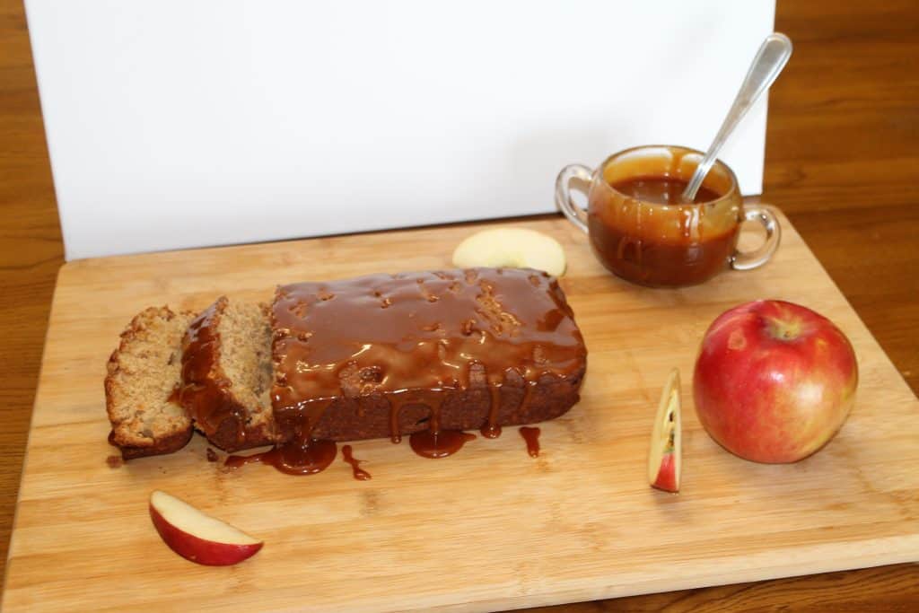 freshly baked apple bread with caramel sauce drizzled on top