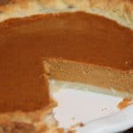 pumpkin pie with one slice missing