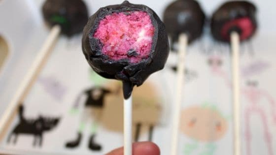 a pink and black cake pop