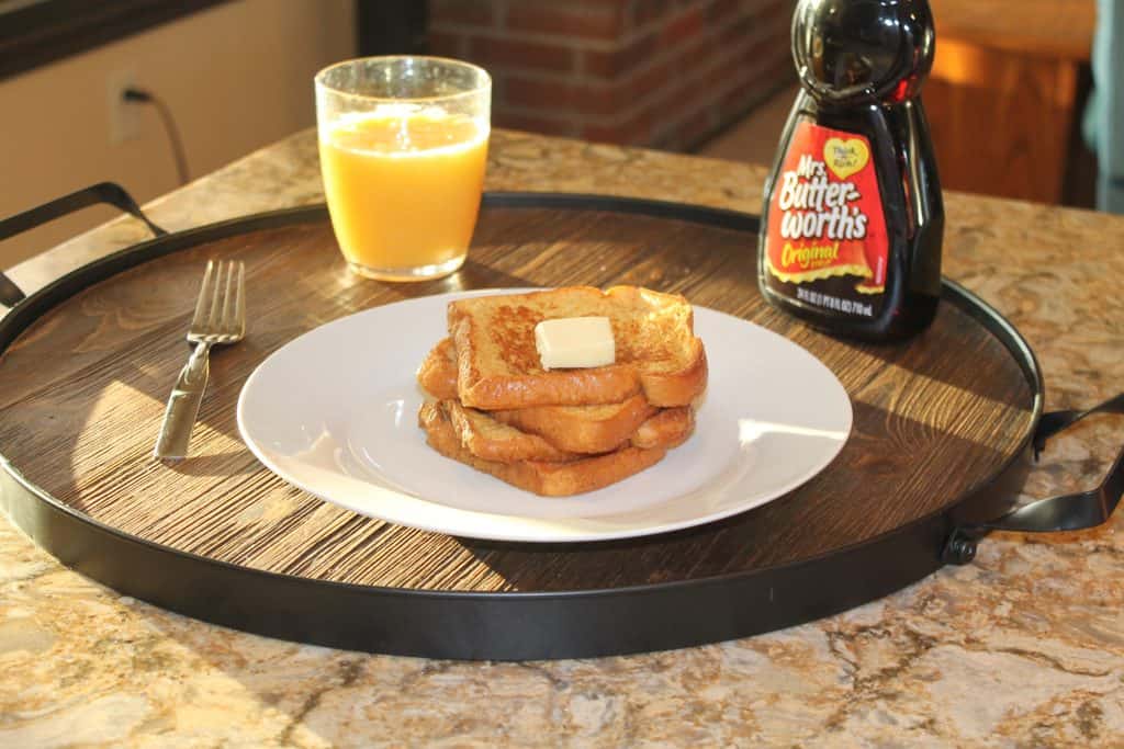 The perfect tray of french toast and orange juice for breakfast in bed